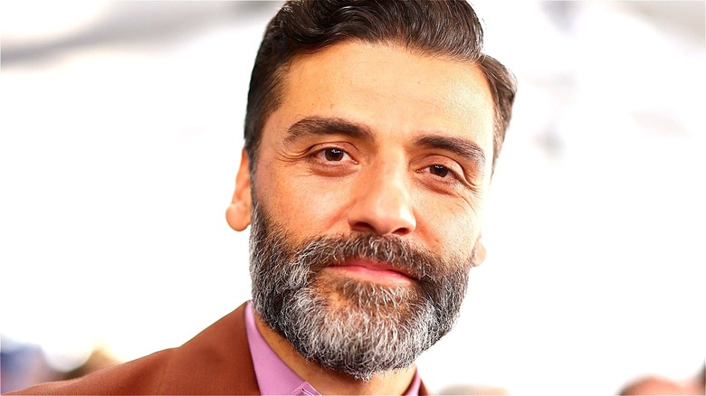 Oscar Isaac smiling warmly