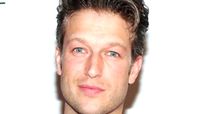 Peter Scanavino posing at event