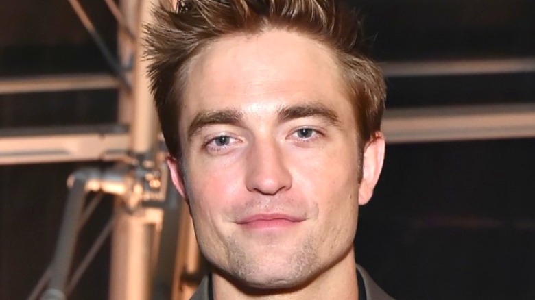 Robert Pattinson smiles in close-up