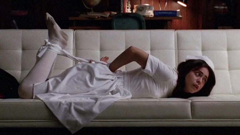 Rosa Salazar crying in white nurse uniform on AHS