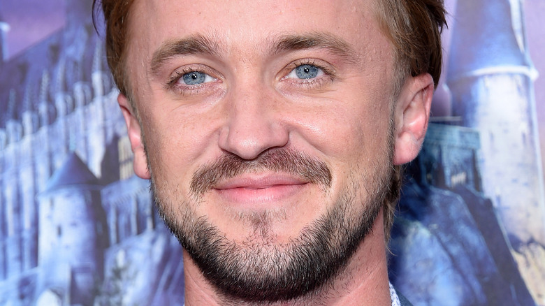 Tom Felton smiles