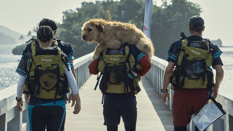 Michael carrying Arthur on his back as the group walks