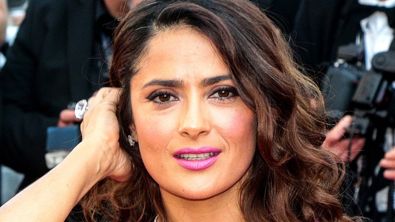 Salma Hayek smiling pink lipstick