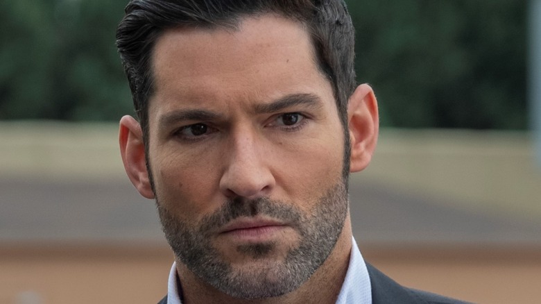 Tom Ellis looks serious