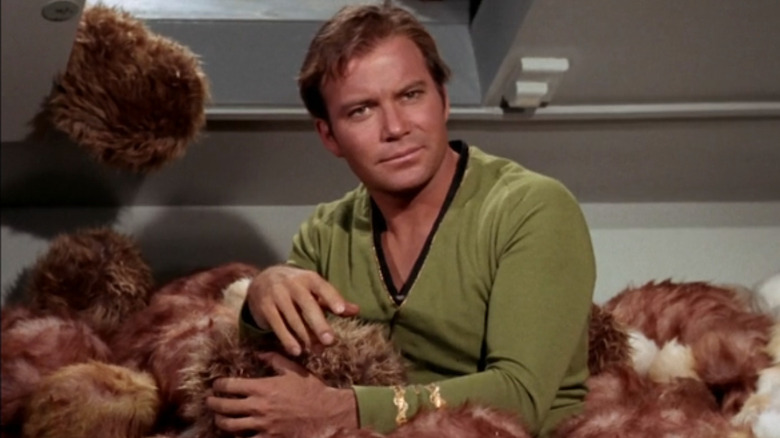 Captain Kirk sitting in a pile of Tribbles in "Star Trek: The Original Series" (1967)