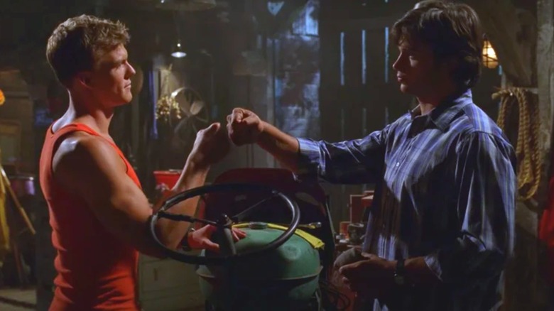 Arthur "A.C." Curry bumps Clark Kent's fist on "Smallville" (2001-2011)