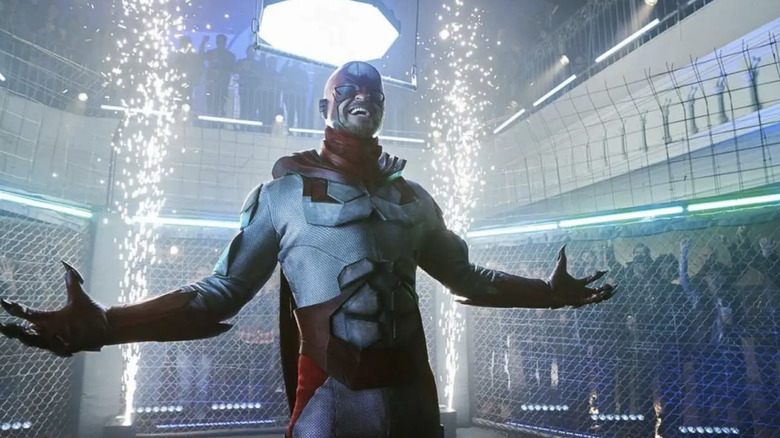 Hawk laughs while in a fighting cage on 