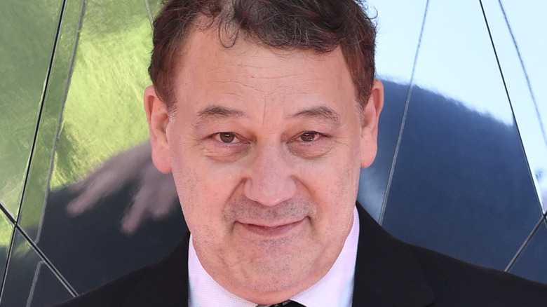 Sam Raimi wears suit and tie