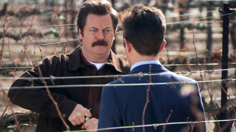 Ron Swanson outside opening wine