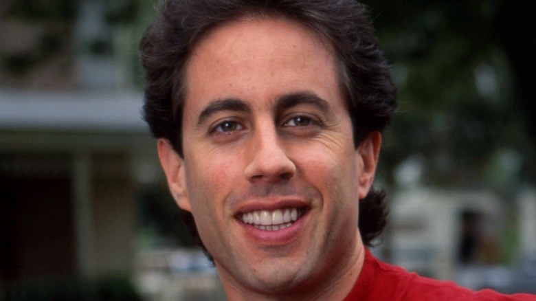 Jerry Seinfeld smirking into camera