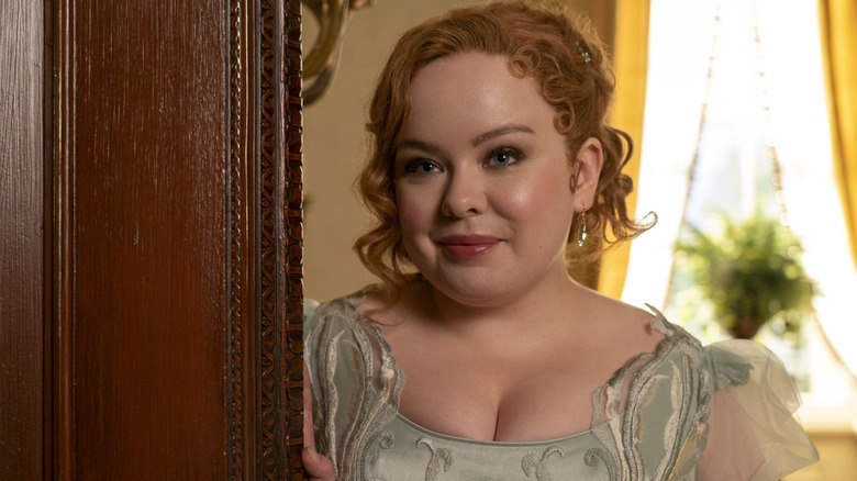 Penelope standing in a doorway in 