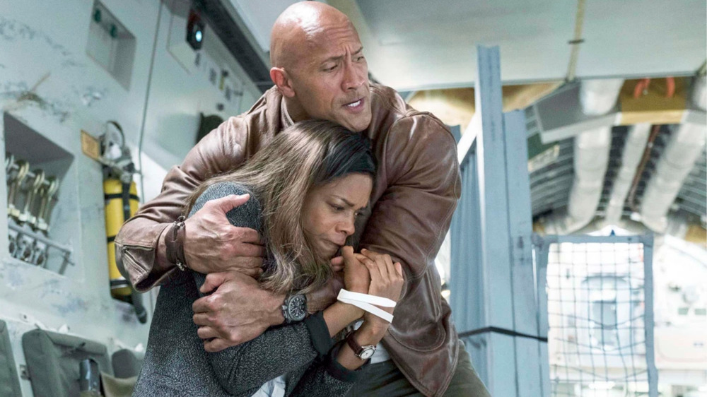 Dwayne Johnson holding woman