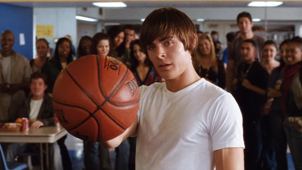 Zac Efron holding basketball
