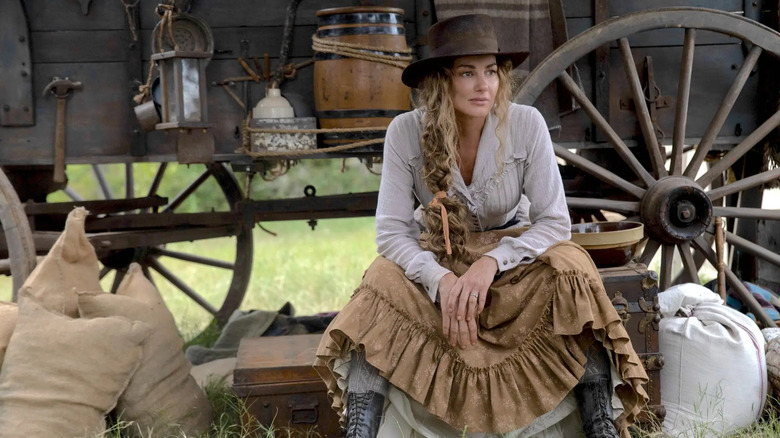Margaret Dutton sitting outside a wagon