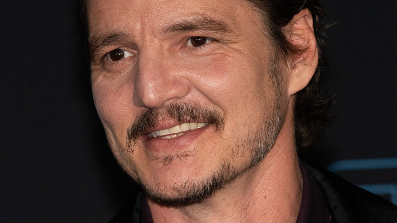 Pedro Pascal at event smiling