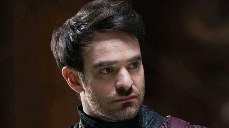 Charlie Cox as Daredevil looking to right