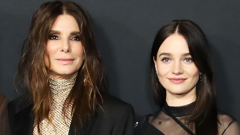 Sandra Bullock and Aisling Franciosi posing together