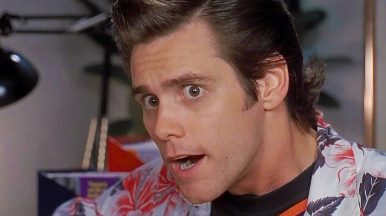 Ace Ventura thinks in close-up, mouth agape