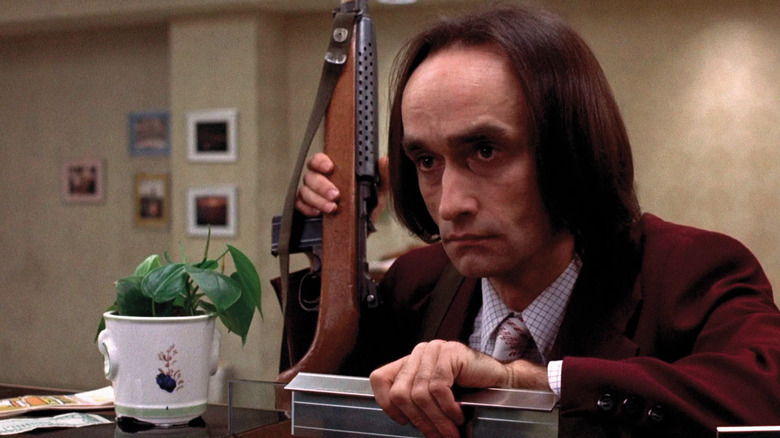 Sal Naturile holds a gun in Dog Day Afternoon