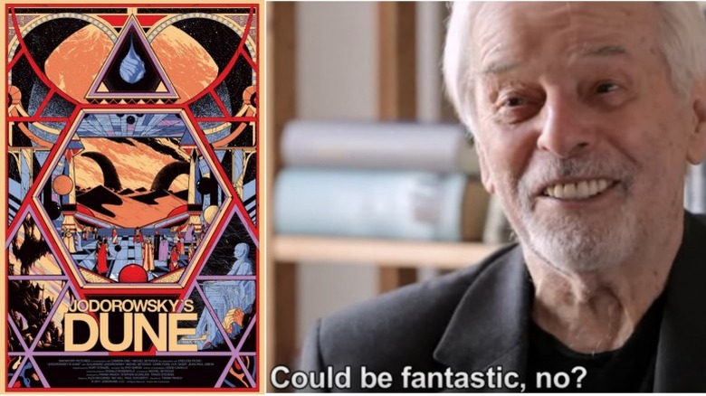 Alejandro Jodorowsky smiling next to a Dune poster