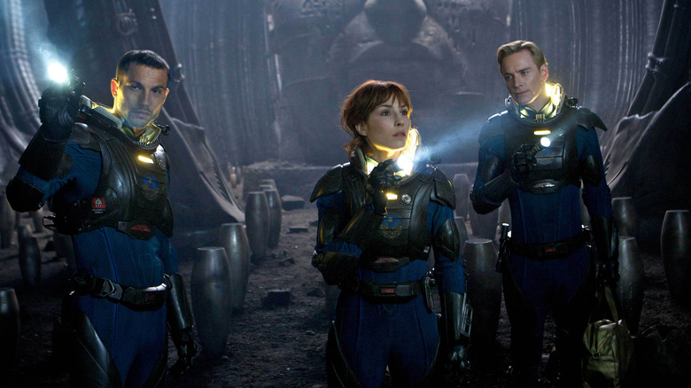 Elizabeth Shaw, David 8 and Charlie search an abandoned ship in "Prometheus" (2012)