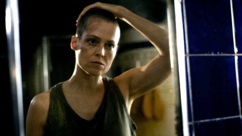 Ellen Ripley admires herself in the mirror in "Alien 3" (1992)