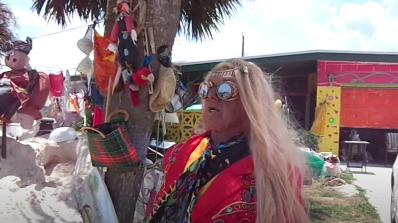 Prince Mongo under a palm tree