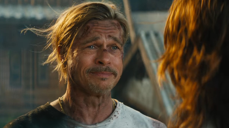 Brad Pitt smiling at Sandra Bullock