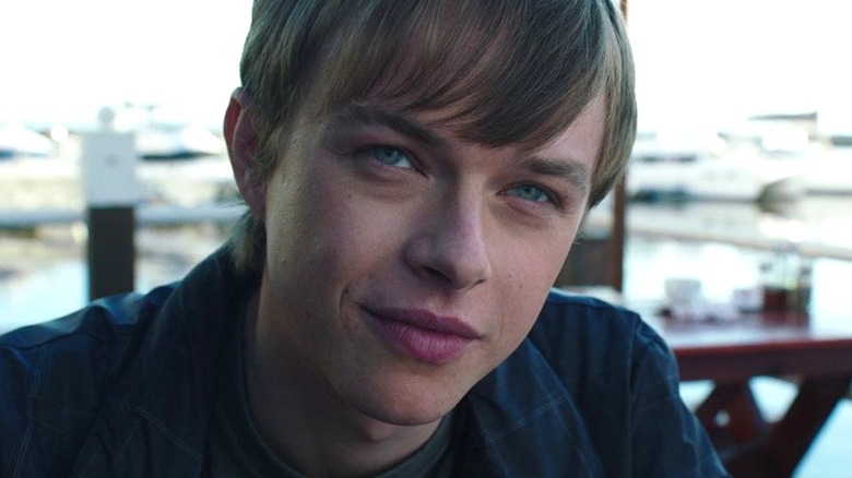 Dane DeHaan staring into a camera