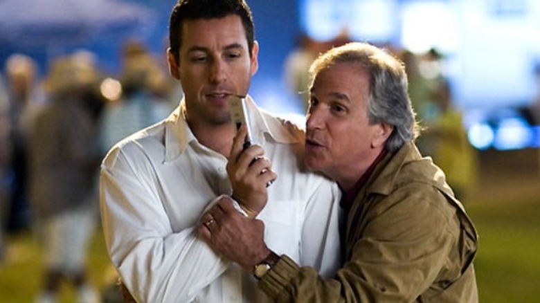 Ted gives Michael a hug at a carnival