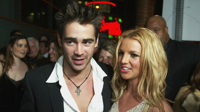 Colin Farrell stands with Britney Spears