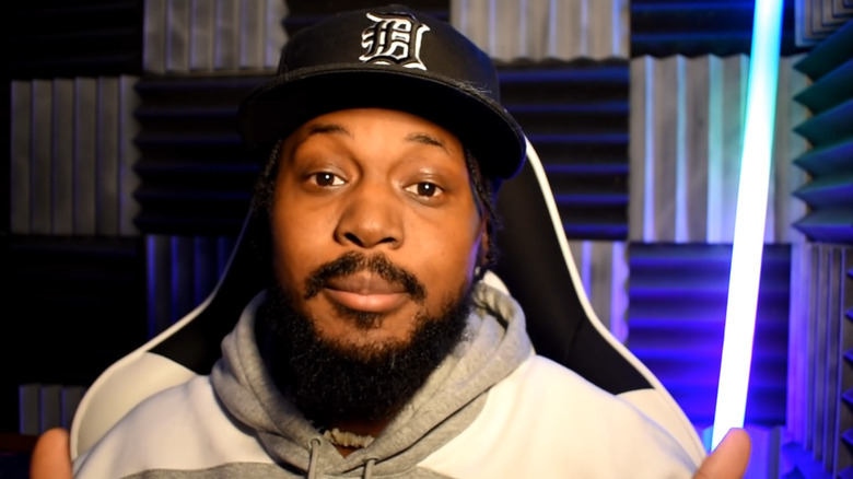 CoryxKenshin wearing gray sweatshirt