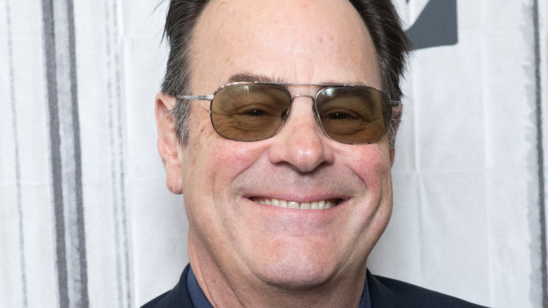 Dan Aykroyd smiles in close-up