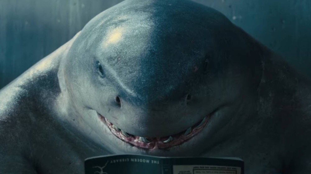 King Shark reads in The Suicide Squad