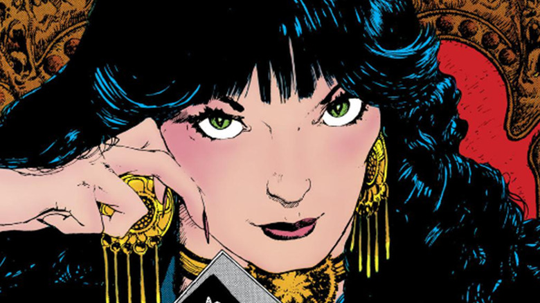 Madame Xanadu holding tarot cards