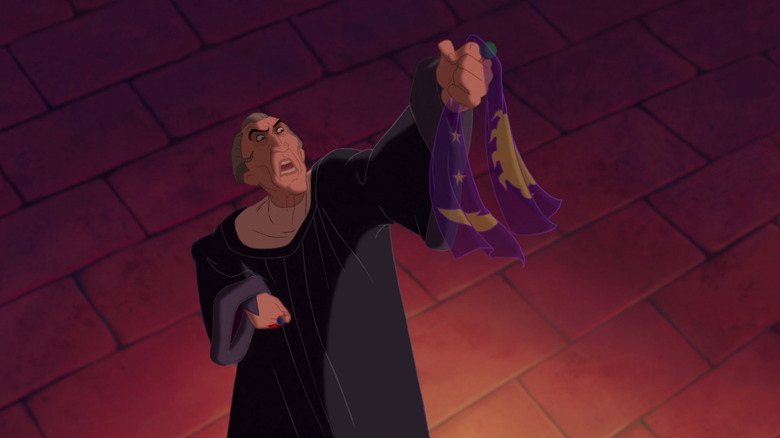 Frollo holding Esmeralda's scarf