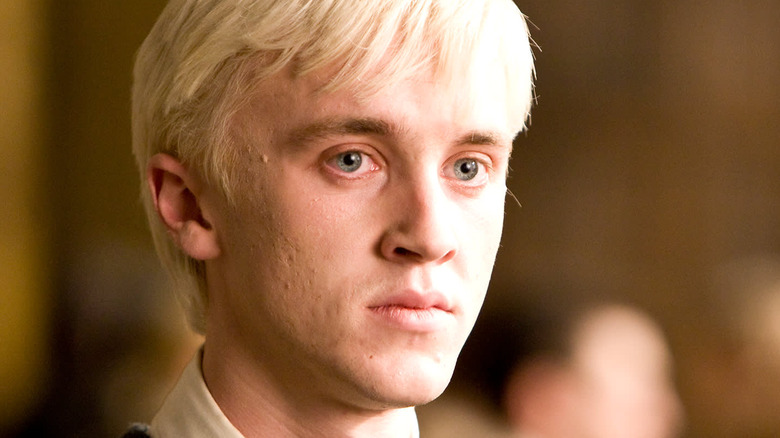 Draco Malfoy starring into the distance