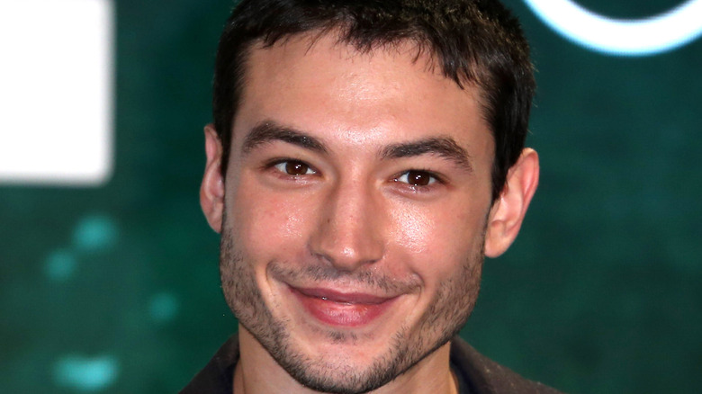 Ezra Miller smiles