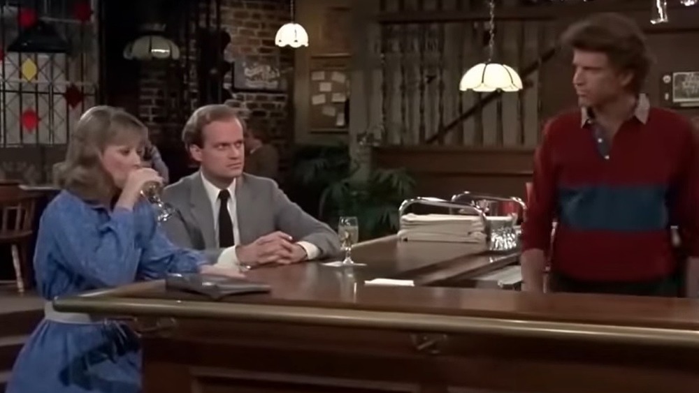 Frasier sitting at bar