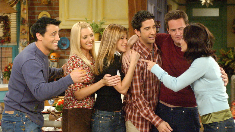 cast of Friends embracing