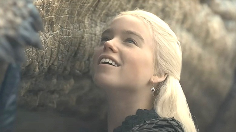 Rhaenyra pets her dragon Syrax