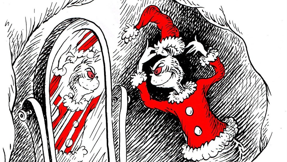 The Grinch wearing Santa suit