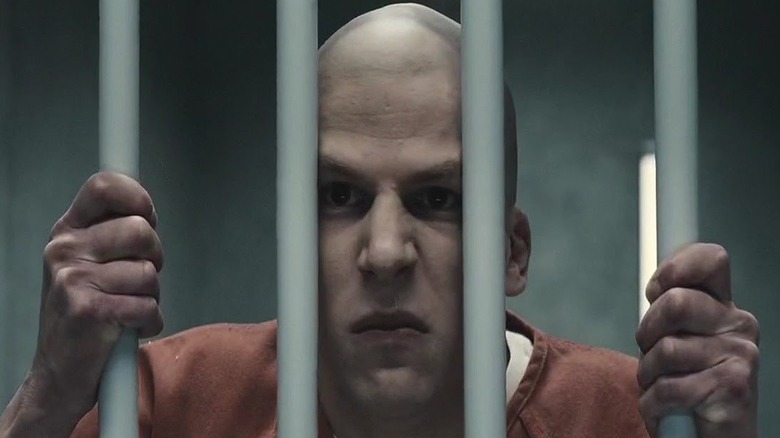 Lex Luthor in jail holding the bars