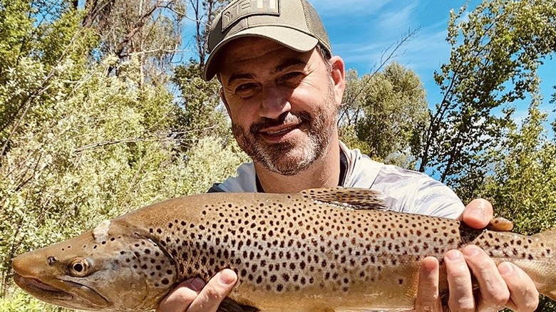 Kimmel smiling with a fish