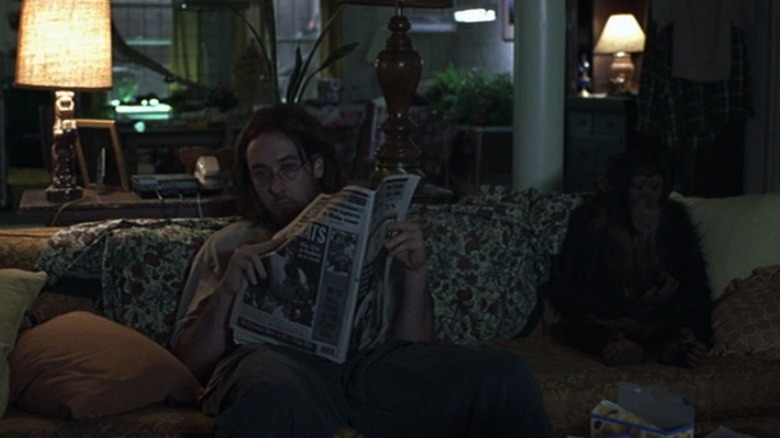 Craig on sofa with chimpanzee in Being John Malkovich