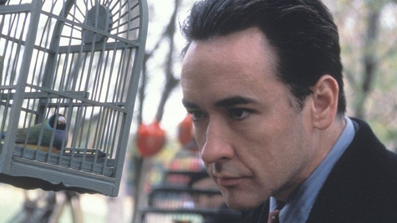 Max Rothman studying birdcage