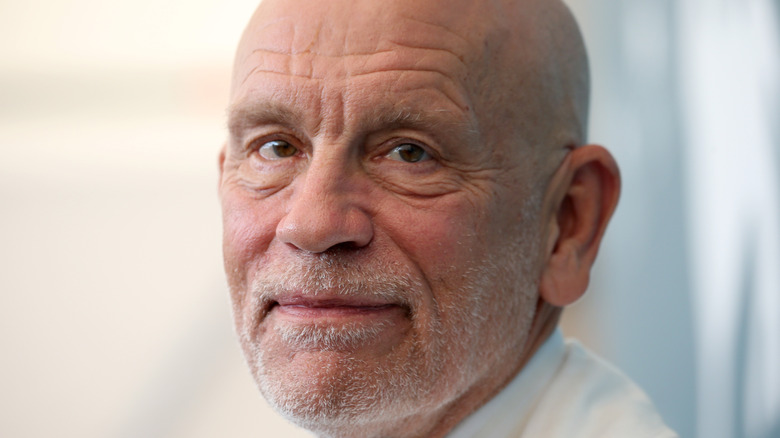 John Malkovich smiles in close-up