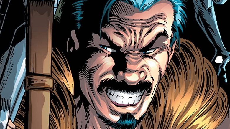 kraven holds rifle and smiles