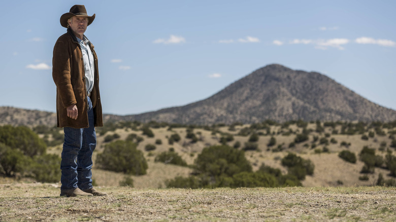 Longmire standing in open space