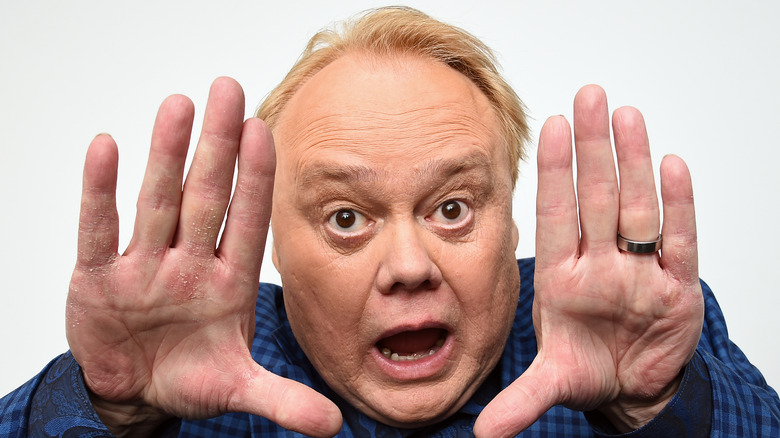 Louie Anderson raising his hands